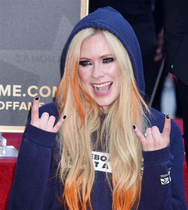 Avril Lavigne says 'relationships are not easy' as she continues to