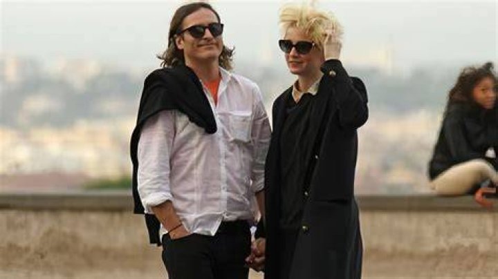 Joaquin Phoenix and Allie Teilz wearing matching outfits to LAX Daily