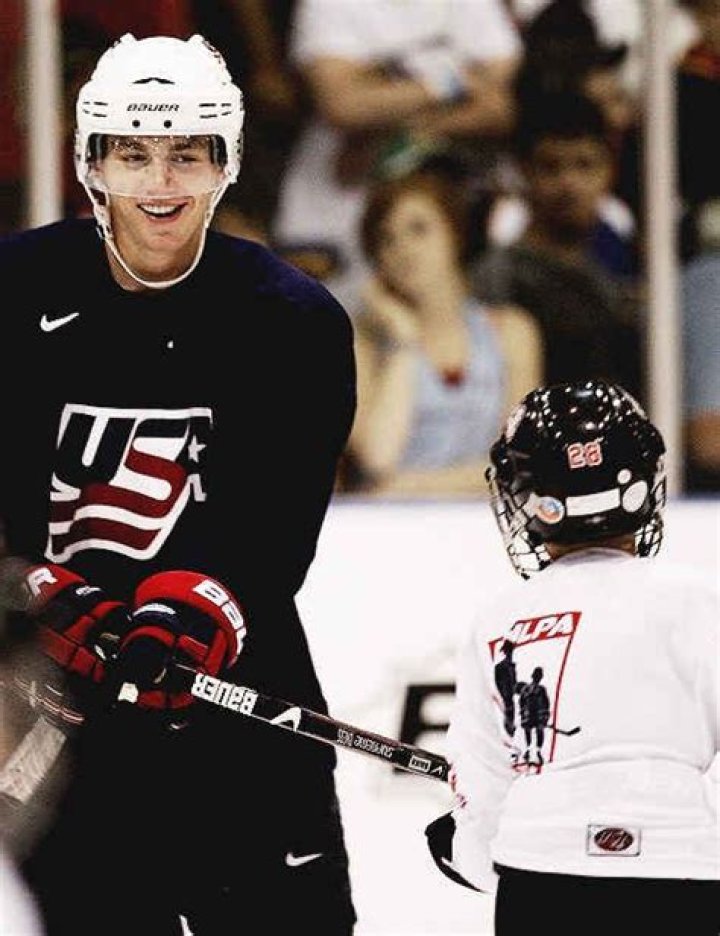 Jonathan Toews and his cousin share a hug during his Stanley Cup Day