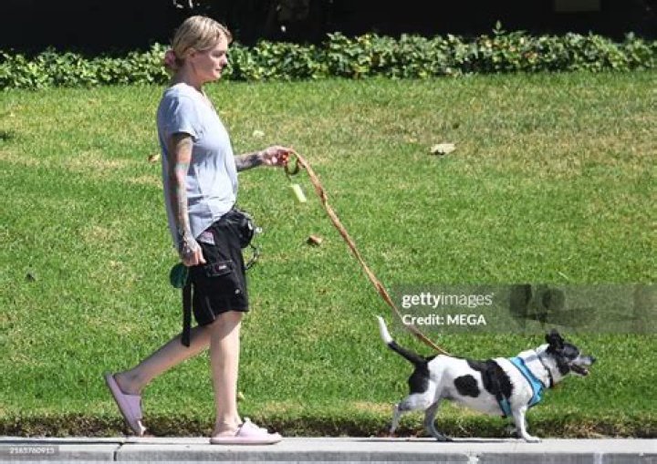 LOS ANGELES, CA AUGUST 7 (LR) Actress Mimi Rogers and husband