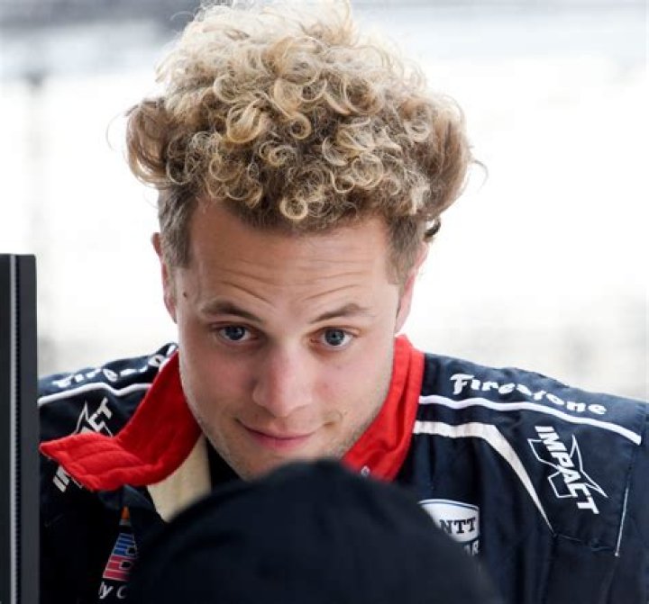 Santino Ferrucci and his dogs are at home at the 2023 Indianapolis 500