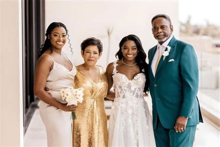 Simone Biles and her Grandparents, Ron and Nellie Biles at the White